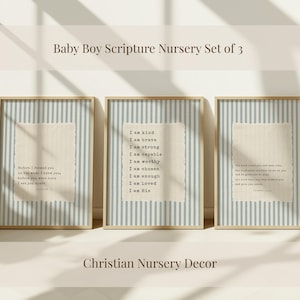 May include: A set of three framed wall art prints featuring light blue and white vertical stripes. Each print displays a textured, off-white center panel with black typewriter-style text containing religious scripture and affirmations.
