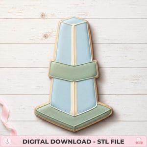 May include: A cookie shaped like a lighthouse or beacon, decorated with light blue icing on the main body, sage green icing on the base and middle band, and white icing piping details. The text DIGITAL DOWNLOAD - STL FILE is at the bottom.