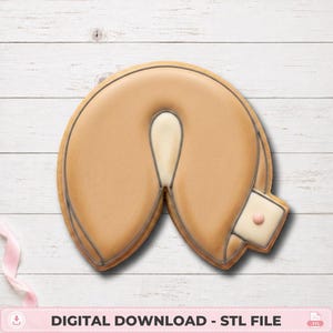 May include: A tan, crescent-shaped fortune cookie-style object with a smooth surface, defined by dark grey outlines. A small, rectangular white tab with a single pink dot is attached to the right side. The text reads: DIGITAL DOWNLOAD - STL FILE.