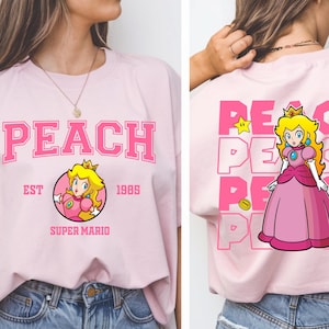 Shirt Super Mario Princess Peach Est 1985, Peach Shirt, Orlando Park Shirts, Disneyland Shirt, T-shirts familie Disney-reis, T-shirt familiecadeau, T-shirt familiecadeau