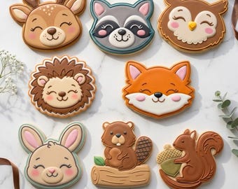 May include: A collection of animal-shaped cookies, including a deer, raccoon, owl, hedgehog, fox, bunny, beaver, and squirrel. Each cookie is decorated with detailed icing and smiling faces. The text "STL INSTANT DOWNLOAD" is at the bottom.