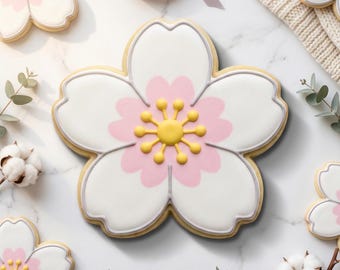 May include: A flower-shaped cookie with white icing, pink accents, and a yellow center. The cookie is outlined in gray and sits on a white surface. Other cookies and decorative elements are also present. The text "STL INSTANT DOWNLOAD" is at the bottom.