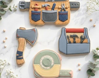 May include: A collection of tool-themed cookies, including a tool belt, axe, tape measure, and toolbox. The cookies are decorated with various colors and details, such as blue denim pockets on the tool belt and a wooden handle on the axe. The text "STL INSTANT DOWNLOAD" is at the bottom.