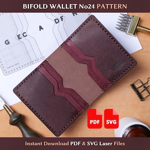 May include: A handmade bifold wallet in shades of burgundy and tan, with visible stitching and a textured leather appearance. The wallet features multiple card slots and a central compartment. The image includes the text "BIFOLD WALLET No24 PATTERN" and "Instant Download PDF & SVG Laser Files".