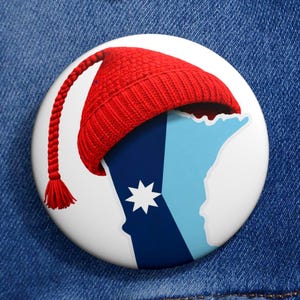 May include: A set of three ceramic mugs with a speckled, matte finish. The mugs are in shades of cream, light gray, and dark gray. Each mug has a simple, minimalist design and a rounded handle.