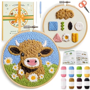 May include: Embroidery kit featuring a cow design in a wooden hoop. The cow is brown and white, surrounded by daisies and green grass. Includes a gift box, needles, scissors, and various colored yarn skeins. A second hoop displays different embroidery patterns.