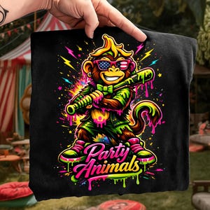 May include: Black t-shirt featuring a cartoon monkey wearing sunglasses with an American flag design, holding a baseball bat. The monkey is wearing a green outfit and the text "Party Animals" is displayed below.