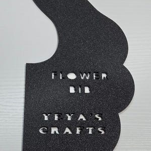May include: Black metal Flower Bib pattern template with the text "FLOWER BIB" and "YEYA'S CRAFTS". The template is reusable and traceable for sewing. The bottom text reads "BIB PATTERN TEMPLATE".
