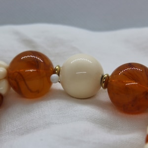 Plastic Brown/Orange and white beaded necklace