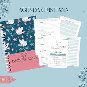 May include: A spiral-bound Christian agenda with a navy blue cover featuring white doves, pink flowers, and the text "DIOS ES AMOR." Includes several loose pages with calendar and daily planning layouts. The text "AGENDA CRISTIANA" is at the top.