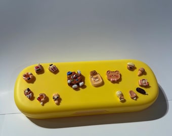 Design your own pencil box with 15 charms