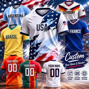 May include: A collection of short-sleeved sports jerseys featuring various national designs including USA, Argentina, Germany, Brazil, and France. Several jerseys display the text 'YOUR NAME' and '00' on the back, with custom options available.