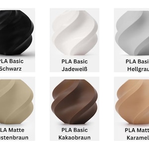 May include: Six small vases with a spiraling, twisted geometric design. The colors include black, white, light gray, desert brown, cocoa brown, and caramel. Each vase is labeled with its material type and color name, such as PLA Basic and PLA Matte.