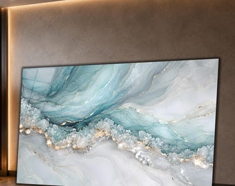 May include: A large rectangular wall art piece featuring an abstract fluid design with swirling shades of teal, light blue, and white. The composition includes textured crystalline formations and thin, metallic gold veins running across the surface.