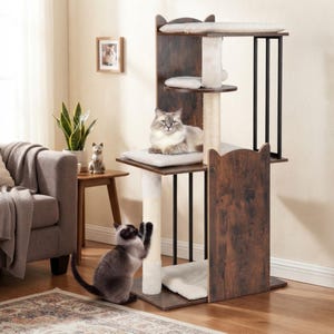 May include: A multi-level cat tree featuring dark brown wood-grain panels, black metal support bars, and cream-coloured sisal scratching posts. The structure includes several platforms with soft, light-coloured cushions for resting and climbing.