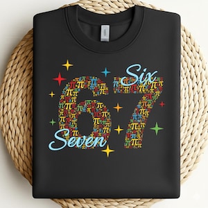 May include: Black sweatshirt featuring the words "Six 67 Seven" in a whimsical font. The numbers are composed of colourful pi symbols, with star-shaped accents in different colours. A fun, educational design.