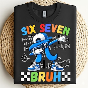 May include: Black sweatshirt with a colorful graphic featuring the words "SIX SEVEN" above a blue Pi symbol dabbing, wearing sunglasses and a hat. The word "BRUH" is below the graphic.