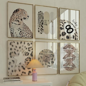 May include: A gallery wall set of six framed prints featuring a leopard, skateboard decks with the text C'EST LA VIE, an eight ball with the word Lucky, a white star on leopard print, a vinyl record labeled blond, and stacked leopard print lips.
