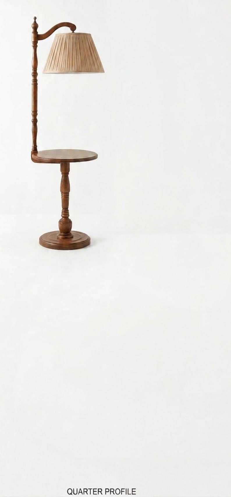 May include: A floor lamp with a brown wooden stand and a circular side table integrated into the base. The lamp features a tall, turned wooden post and a pleated, light tan fabric lampshade. The base is round and sturdy, supporting the table.