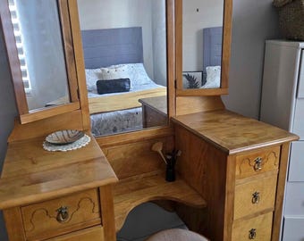 Beutifull Antique dress up vanity made out of  teak and walnut solid wood. Fully restored with its lion feet legs and a round stool.
