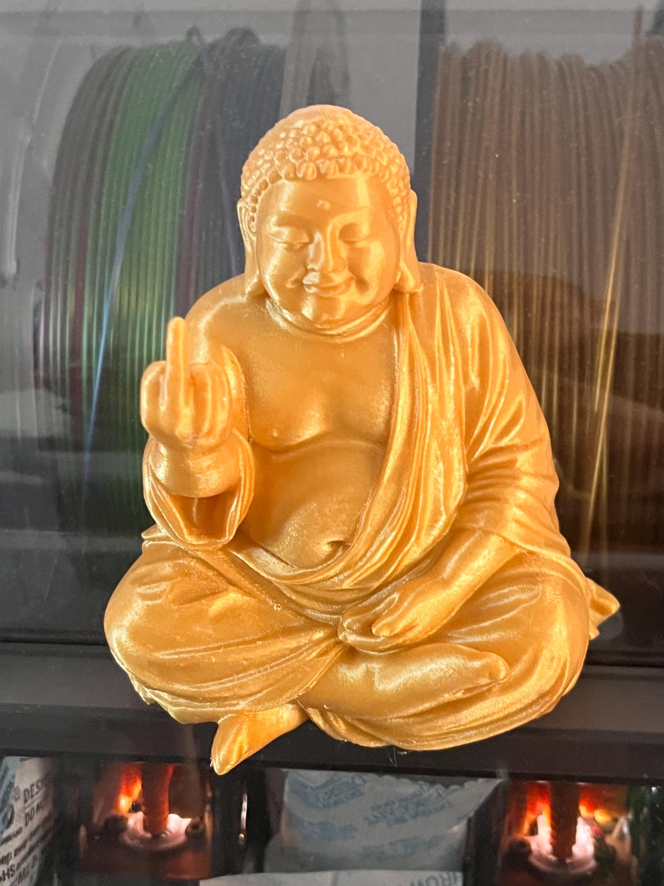 Humorous Buddha Giving the Middle Finger – Unusual Buddha Statue