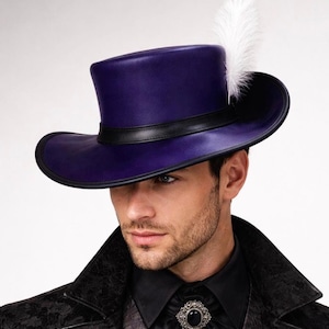 May include: A purple top hat with a black band and brim, accented by a white feather. The hat is part of a formal outfit, including a black coat and shirt, and a decorative brooch.