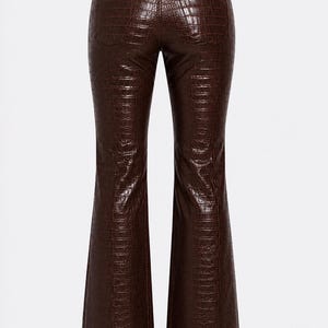 May include: Dark brown trousers featuring a glossy finish and a textured crocodile skin pattern. These pants have a high-waisted design with a button closure, belt loops, and a flared leg silhouette that widens towards the bottom hem.