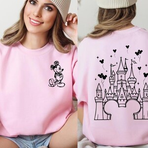 Retro magical castle sweatshirt inspired by Magic Kingdom and Walt Disney World, featuring a vintage style fairytale castle graphic with soft pastel tones, sparkling star details, and a cozy relaxed fit, perfect for Disney girls trips, family vacations, matching group outfits, birthday girl or birthday boy celebrations, and unforgettable theme park memories filled with magic, laughter, and castle dreams.