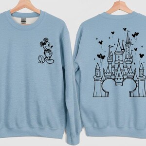 Retro magical castle sweatshirt inspired by Magic Kingdom and Walt Disney World, featuring a vintage style fairytale castle graphic with soft pastel tones, sparkling star details, and a cozy relaxed fit, perfect for Disney girls trips, family vacations, matching group outfits, birthday girl or birthday boy celebrations, and unforgettable theme park memories filled with magic, laughter, and castle dreams.