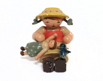 Wendt & Kuehn Erzgebirge figurine, girl with doll and bird, made in Germany, collectible figurines, wooden hand crafted figurine