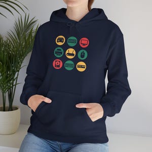 May include: Navy blue hooded sweatshirt with a front pocket. The front displays a design of nine colourful circles, each with a different computer icon, such as a printer, hard drive, and keyboard.