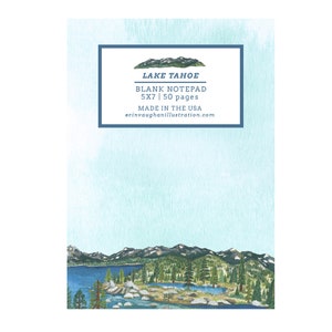 May include: A blank Lake Tahoe notepad with a watercolor illustration. The notepad is 5x7 inches and has 50 pages. The design features a scenic view of a lake, mountains, and trees. The text on the notepad reads "Lake Tahoe Blank Notepad".