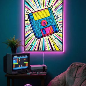 May include: A room with a retro theme, featuring a neon-lit artwork of a floppy disk, with a vibrant colour scheme. A vintage TV displays a video game, complemented by a console and controllers. A neon clock and beanbag chair complete the nostalgic setup.