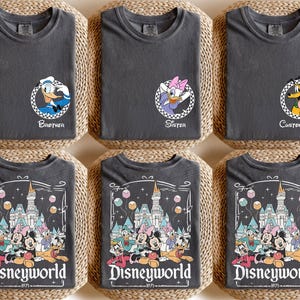 May include: Six charcoal gray t-shirts with Disney character graphics. Three shirts have character portraits with text: "Brother", "Sister", and "Custom Name". The other three shirts feature a "Disneyworld" graphic.