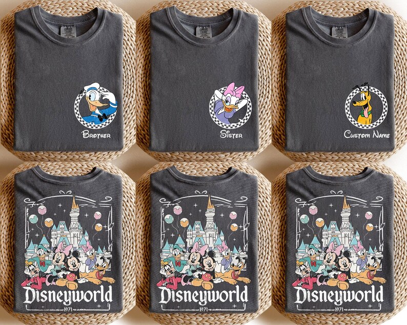 May include: Six charcoal gray t-shirts with Disney character graphics. Three shirts have character portraits with text: "Brother", "Sister", and "Custom Name". The other three shirts feature a "Disneyworld" graphic.