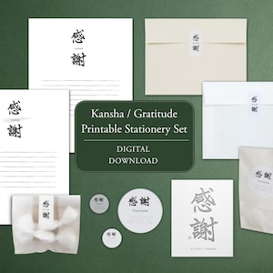 May include: A printable stationery set featuring white paper sheets with black Japanese kanji characters for gratitude, matching envelopes with seals, circular stickers, and a small translucent bag, all labelled Kansha / Gratitude Printable Stationery Set.