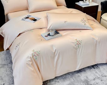 Juego completo de ropa de cama de algodón satinado de fibra larga con flores bordadas