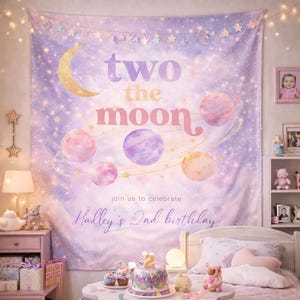 May include: A large, purple and pink tapestry with the words "two the moon" and planet illustrations. The tapestry is decorated with stars and a gold crescent moon. The text "join us to celebrate Hadley's 2nd birthday" is also visible.