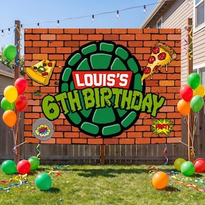 May include: A rectangular banner with a brick wall pattern featuring a green turtle shell graphic, two pizza slices, and the text "LOUIS'S 6TH BIRTHDAY" in white and green. A circular manhole cover graphic with "ZAP!" and a starburst "PARTY" icon are included.