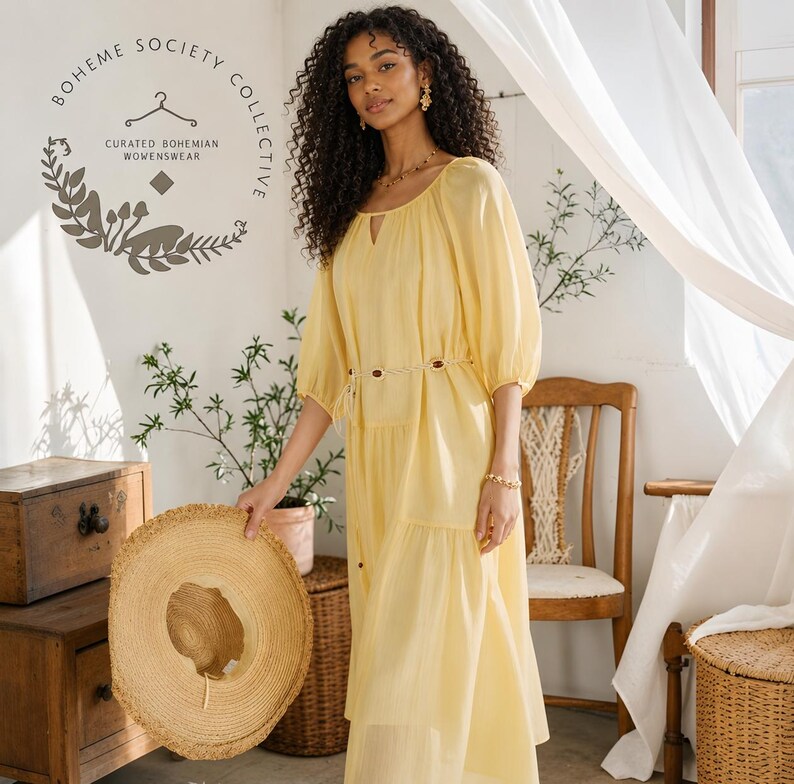 Yellow boho midi dress for women featuring lightweight Tencel fabric, romantic puff sleeves, flowing A-line silhouette, and adjustable lace-up waist detail. Feminine cottagecore summer dress with soft airy texture and relaxed fit perfect for brunch dates, vacations, garden parties, tea parties, casual chic styling, and everyday elegance. Pastoral-inspired midi dress in buttery yellow tone designed for breathable comfort and graceful movement during spring and summer wear.