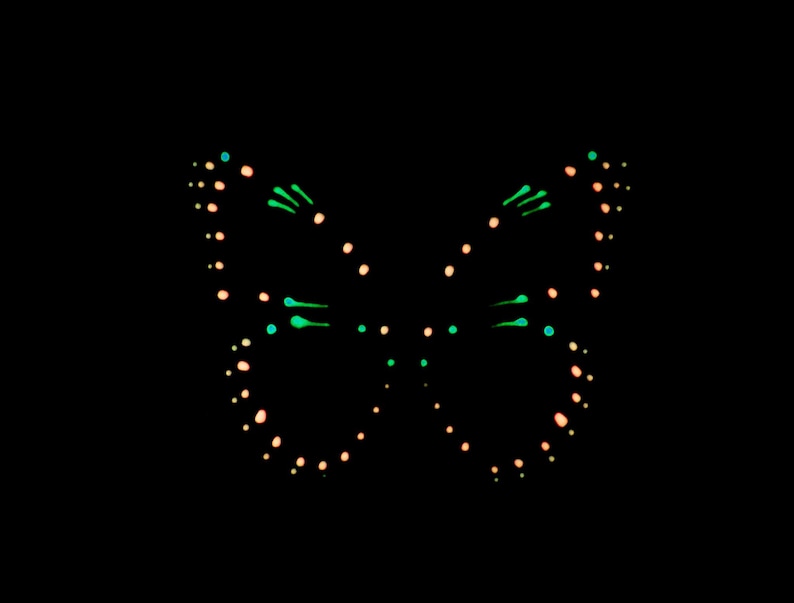 May include: A butterfly graphic composed of small, glowing dots and short, thin lines arranged in a symmetrical pattern against a solid black background. The design features a mix of light peach and vibrant neon green luminous markings.