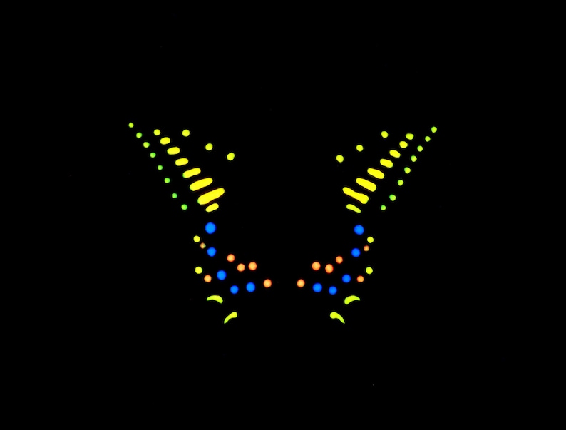 May include: A symmetrical graphic design on a black background featuring two mirrored wing-like shapes. The design is composed of small, glowing dots and dashes in vibrant shades of neon yellow, bright blue, and soft orange arranged in patterns.
