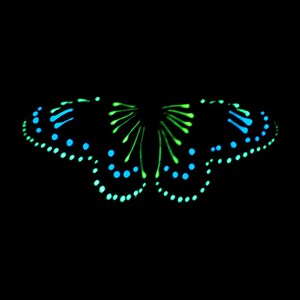 May include: A glowing butterfly graphic set against a solid black background. The design features vibrant neon blue and bright lime green dots and elongated strokes arranged in a symmetrical pattern to form the shape of butterfly wings.