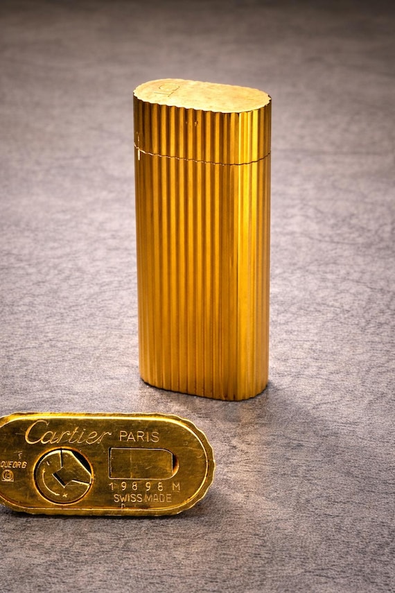 cartier gold cigarette lighter Vintage Reeded Lighter, Fully working and with box  The Store at Woodshed rare find. Vintage 1980 Cartier Oval 24k