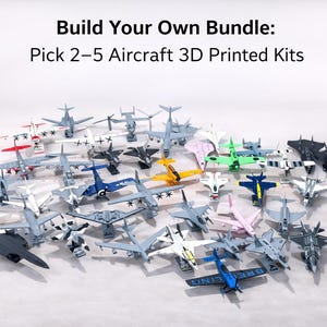 May include: A collection of 3D printed aircraft kits in various colors, including gray, white, pink, green, and blue. The image includes the text "Build Your Own Bundle: Pick 2-5 Aircraft 3D Printed Kits."