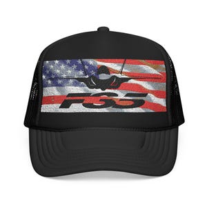May include: Black trucker hat featuring an embroidered American flag design with a fighter jet silhouette and the letters "FSS" in white. The hat has a mesh back and a curved brim.