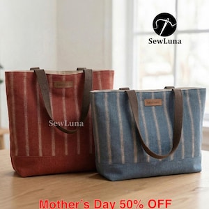 May include: Two tote bags with vertical striped patterns. One is red, the other is blue. Both have brown straps and a "handmade" tag. The bags are on a wooden surface. The text "SewLuna" and "Mother's Day 50% OFF" are visible.