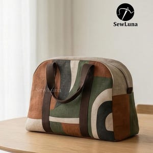 Handmade arched duffle bag sewing pattern featuring an earthy geometric print in terracotta, forest green, and charcoal. The modern weekender bag has dark brown wrap-around straps and sits on a beige background.