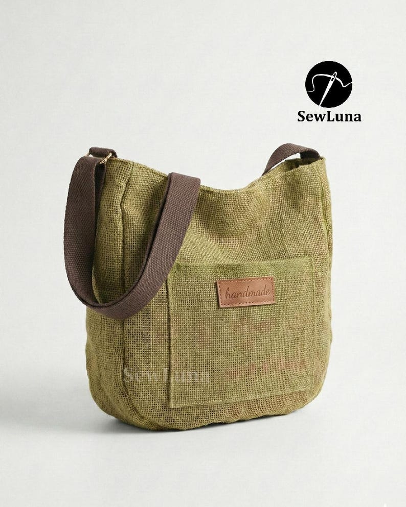 May include: Olive green burlap tote bag with a brown shoulder strap and a front pocket. The bag features a brown leather patch that reads "handmade". The SewLuna logo is in the upper right corner.