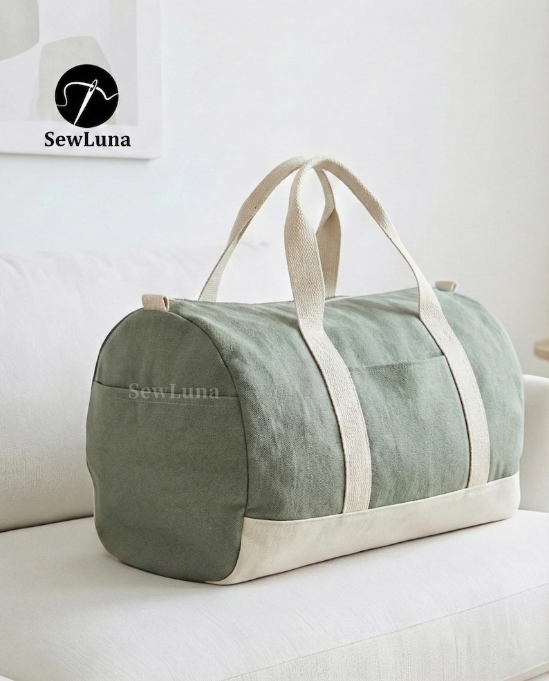 Minimalist earthy green and beige canvas duffle bag sewing pattern PDF with sturdy webbing handles and a side pocket, displayed against a light grey background. Perfect weekender bag sewing project.
